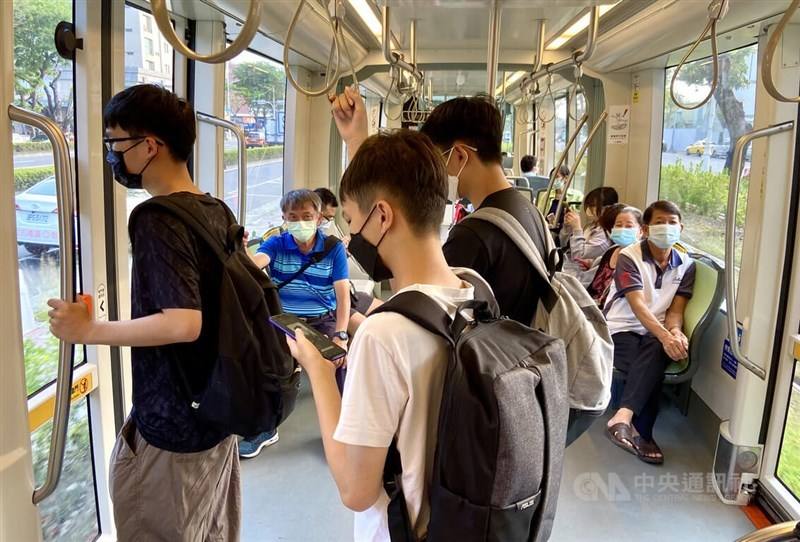 Commuters ride the metro in Kaohsiung in masks to prevent from getting sick