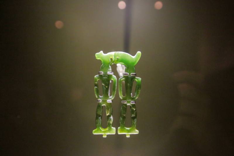 This jade pendant depicting two human figures and a beast is listed as a national treasure. (MOFA file photo)