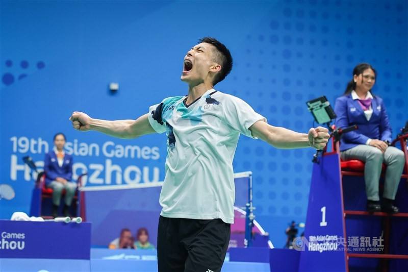 Taiwanese badminton player Chou Tien-chen clinches his fists in victory after a match at the Asian Games in Hangzhou, China, on Oct. 3, 2023