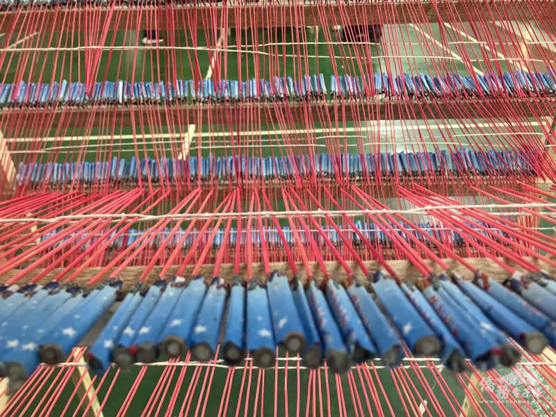 A closeup view of the hundreds of small rockets making up a rectangular rocket structure.