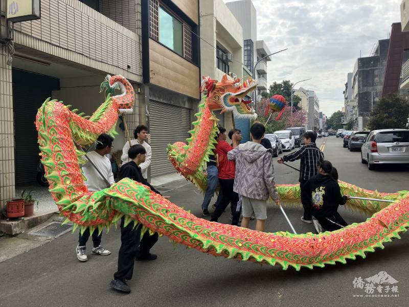 A group of dragon dancers move in sync, chasing a “Pearl of Wisdom.”