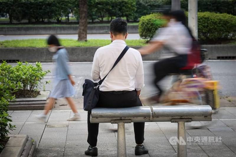 A man sits on a roadside bench in Taipei's Zhongzhen District in this undated photo.