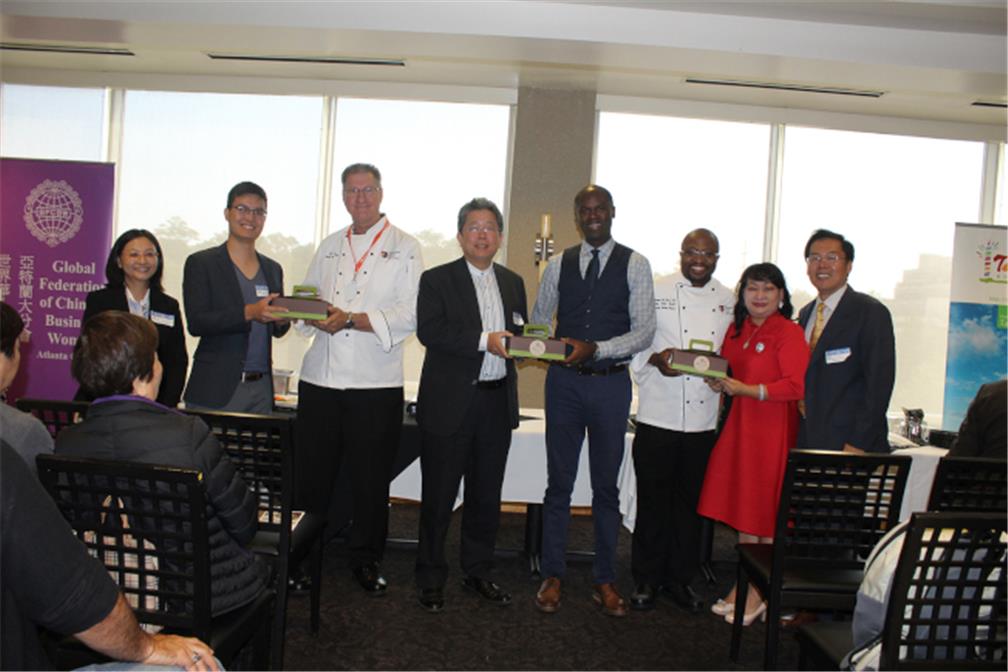 President of Jackie Chen from GFCBW, Director General Vincent Liu from Taipei Economic and Cultural Office in Atlanta, and President of Alex Day from TJCCGA gave moon cake as a gift to President of Newton Myvett and professors from Art Institute of Atlant.