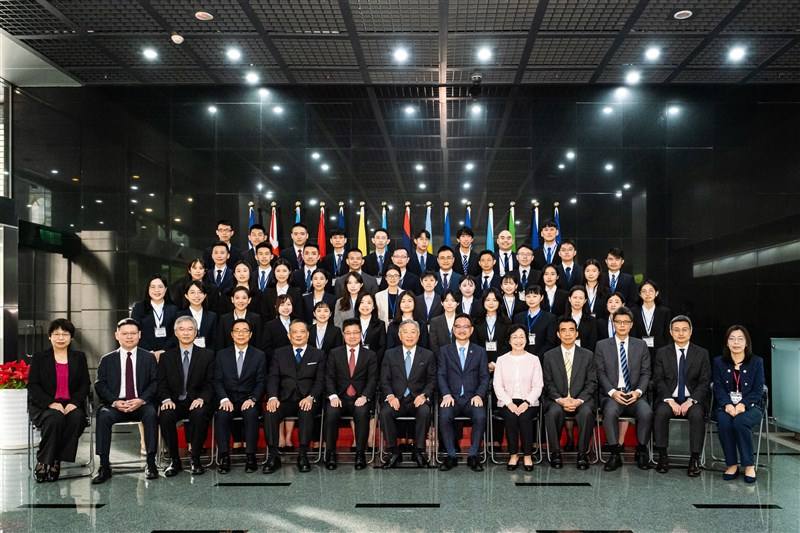 Deputy Foreign Minister Tien Chung-kwang (seventh left in front row) and other Ministry of Foreign Affairs officials pose with the most recent class of diplomat recruits, consisting of more women than men, in this undated photo. Photo courtesy of Ministry