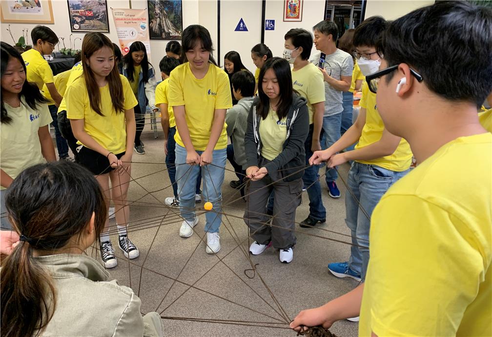 Team-building exercise: FASCA collaborated to build a ping pong net by using yarn.