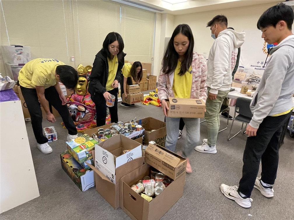 Thanksgiving Day food drive activity: FASCA students help sort donations.