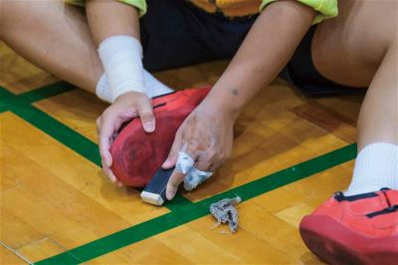 Tug-of-war shoes are abraded to provide consistent friction.