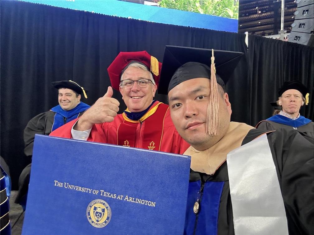 While starting up his business, George Chen (second from right) continued his professional development and completed an executive dual-degree master's program in management.
