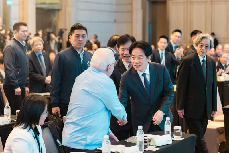 President Lai Ching-te shakes hands with former President of Poland Lech Walesa.