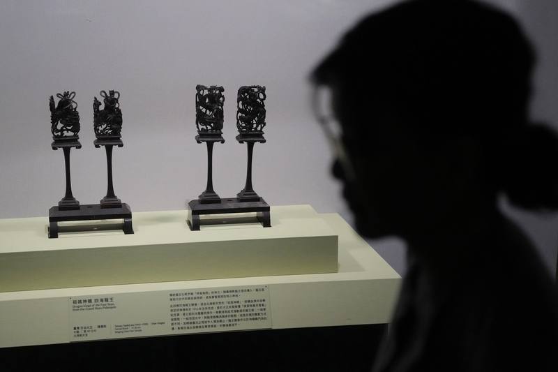 Wooden sculptures from a Mazu palanquin are displayed at the National Palace Museum on Monday. CNA photo March 24, 2026