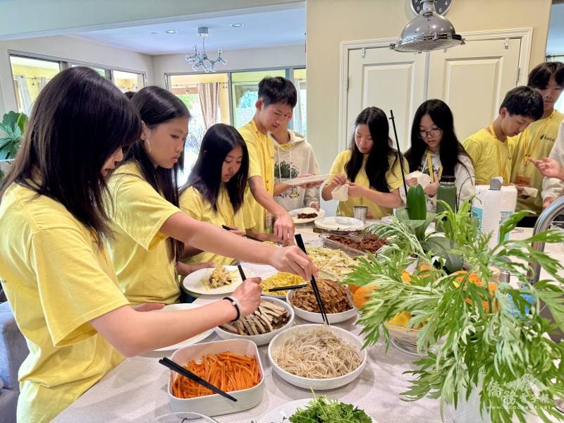 FASCA members enjoy 潤餅 (spring rolls) prepared by parent Ling Chan while learning about Qingming Festival traditions, connecting cultural heritage with community engagement.