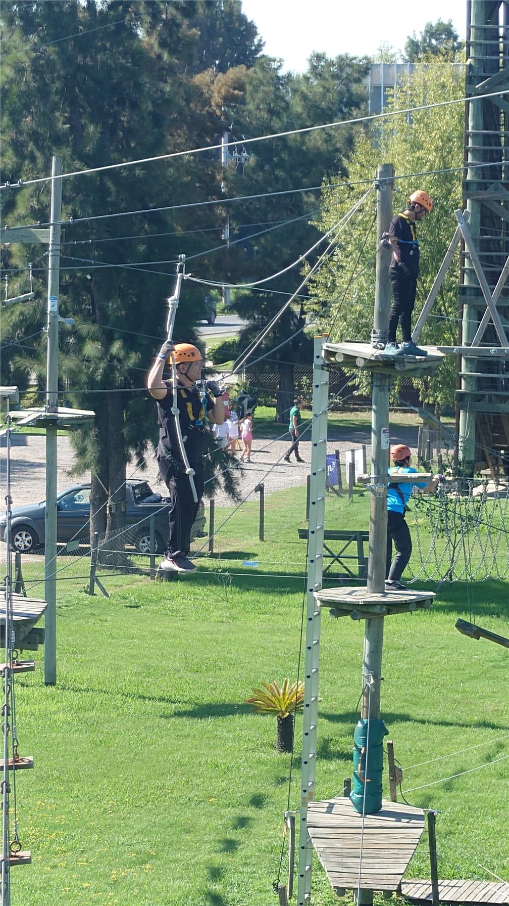 A participant gliding along a zipline.