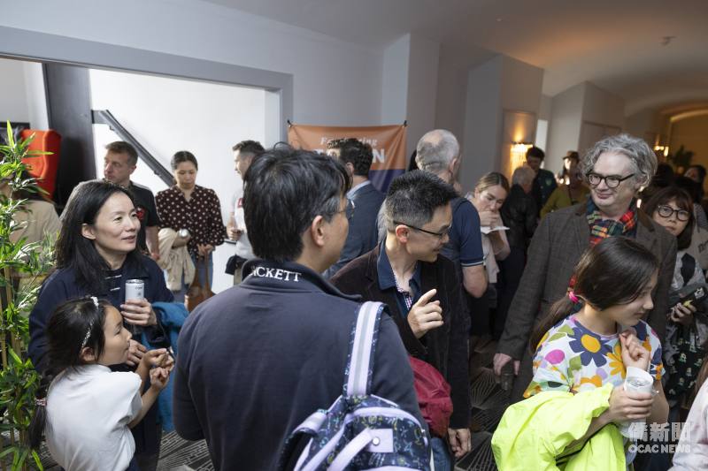 Attendees enjoy a vibrant reception featuring Taiwanese food.