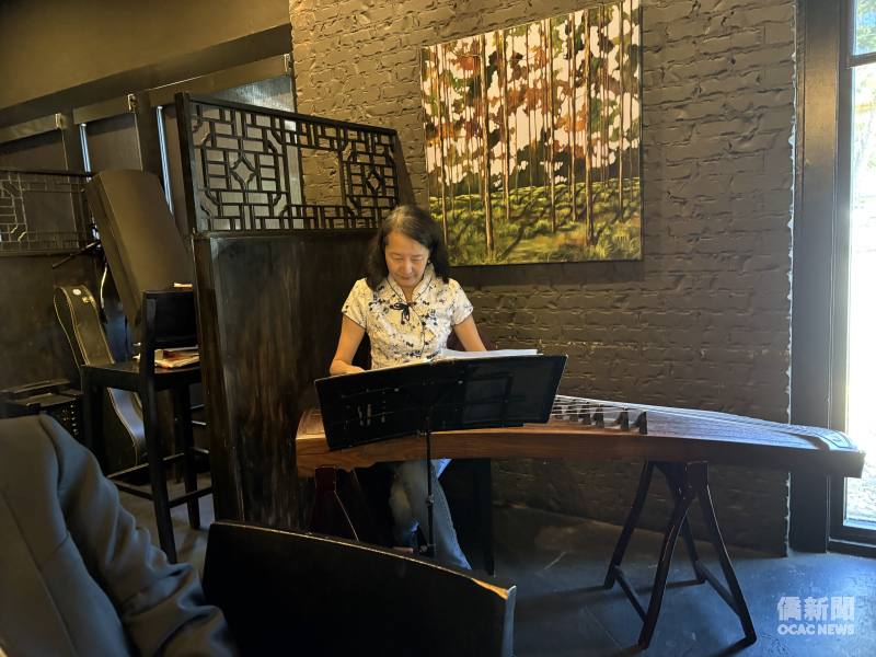 Dr. Shuyuan Metcalfe performs traditional Chinese music on the guzheng.